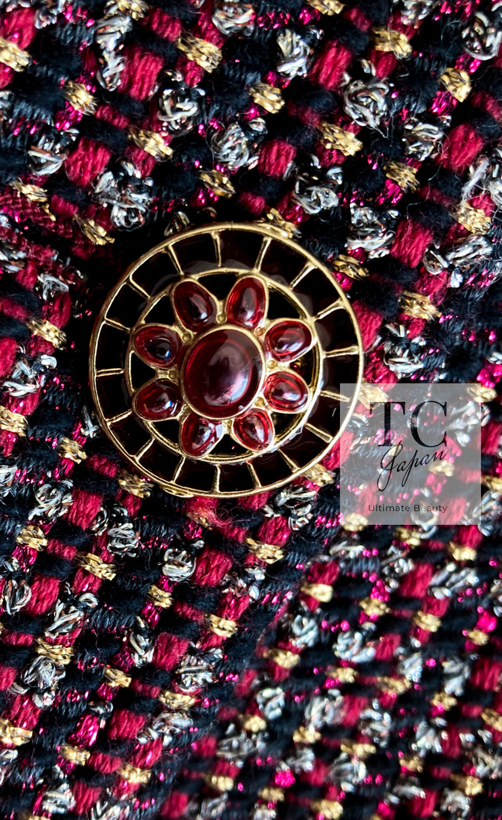 CHANEL red glass jewel button on multicolor tweed close-up